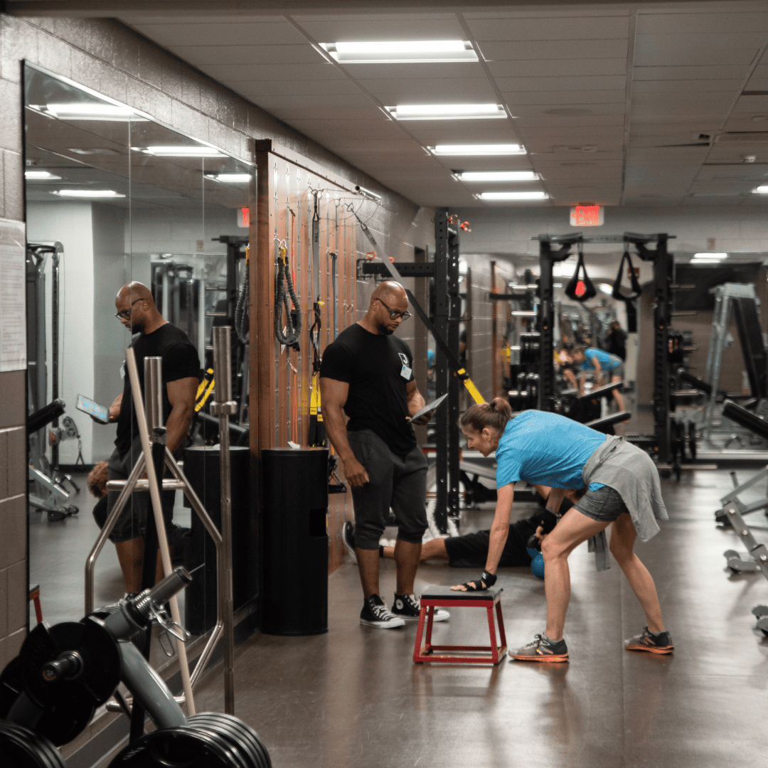 Two people in a gym.