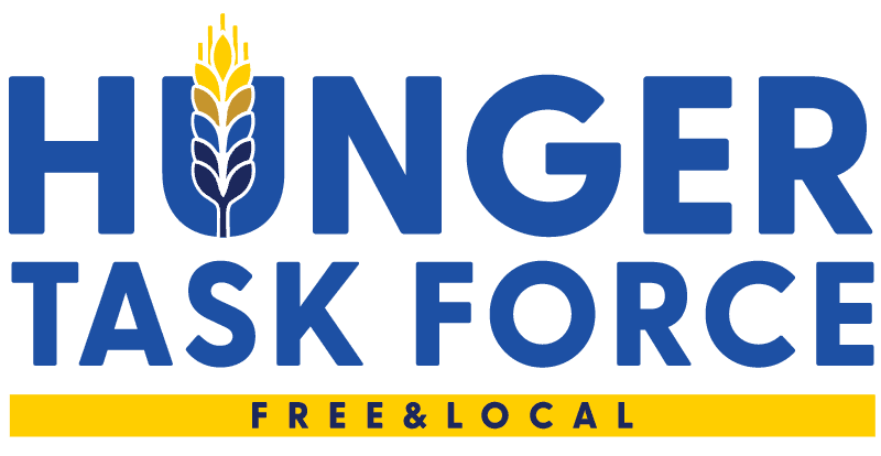 Logo with the words “Hunger Task Force” in blue, a wheat symbol in place of the “U”, and “Free & Local” written below on a yellow bar.