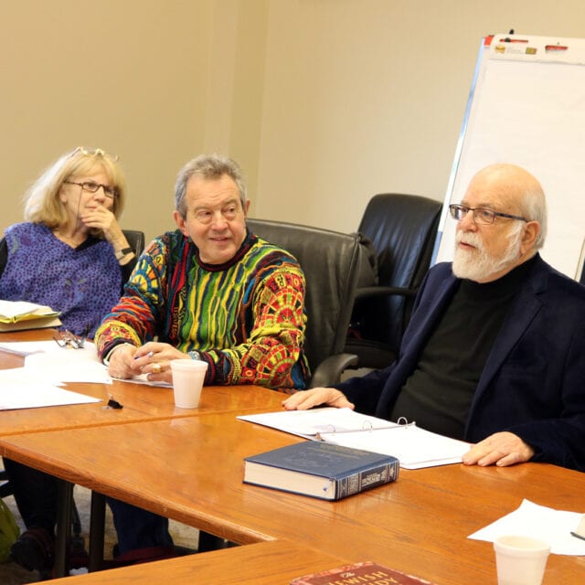 A group of people sitting at a table.