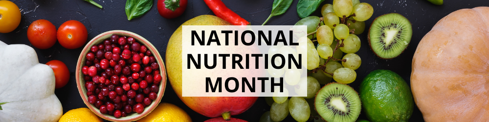 Assortment of fruits and vegetables, including grapes, kiwi, and tomatoes, surrounds text reading "National Nutrition Month" on a dark background.