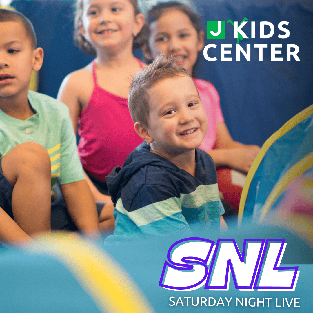 A group of young children sit and smile in a play area. Text reads "J Kids Center" and "SNL Saturday Night Live.